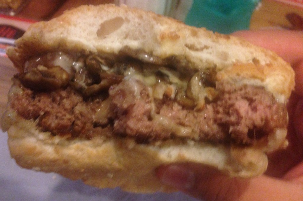 The view from inside, patty perfectly cooked and toppings oozing over